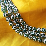 HAND PAINTED' EYE' FACETED ONYX BEADS' LIMITED EDITION' 10 MM SOLD BY PER LINE PACK ' 35-37 BEADS APPROX.