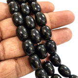 Per Line Black, Oval Dholki Shape Solid Color Glass Beads Imported in size about 10x13mm