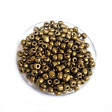 50 grams Pkg. Gold Metallic glass beads in size about 6/0 Size