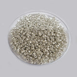 50 GRAMS PKG. METALLIC silver GLASS SEED BEADS IN SIZE ABOUT 11/0