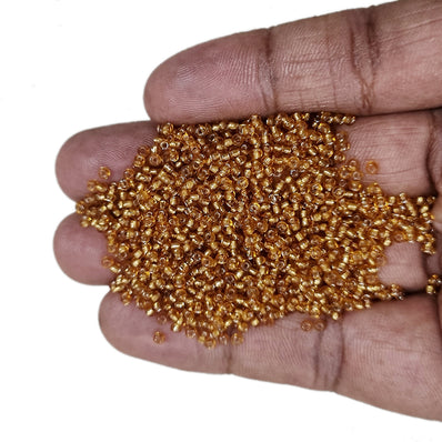 100 grams pkg. Super quality 11/0 size (2mm size) glass seed (sugar Beads) Silver line gold
