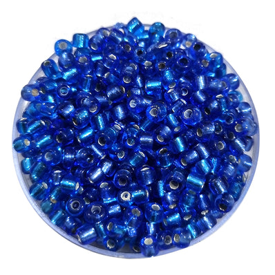 100 grams pkg. 6/0 size (4mm size) glass seed (sugar Beads) Silver line Blue Color
