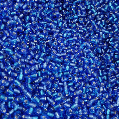 100 grams pkg. 6/0 size (4mm size) glass seed (sugar Beads) Silver line Blue Color