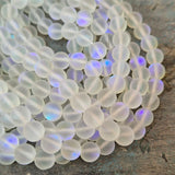 1 STRING/LINE PACK MYSTIC AURA QUARTZ 8 MM ROUND 46-47 BEADS APPROX