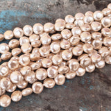8mm, Coin Shape Shell Pearl Beads with a smooth, glossy finish, perfect for elegant necklaces, bracelets, and premium jewelry designs. Uniform, classy, and ideal for DIY creators. Sold Per Line 47~48 beads
