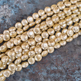 8mm, Coin Shape Shell Pearl Beads with a smooth, glossy finish, perfect for elegant necklaces, bracelets, and premium jewelry designs. Uniform, classy, and ideal for DIY creators. Sold Per Line 47~48 beads
