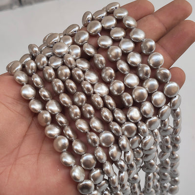 10mm, Coin Shape Shell Pearl Beads with a smooth, glossy finish, perfect for elegant necklaces, bracelets, and premium jewelry designs. Uniform, classy, and ideal for DIY creators. Sold Per Line 37~38 beads