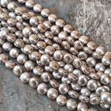 10mm, Coin Shape Shell Pearl Beads with a smooth, glossy finish, perfect for elegant necklaces, bracelets, and premium jewelry designs. Uniform, classy, and ideal for DIY creators. Sold Per Line 37~38 beads