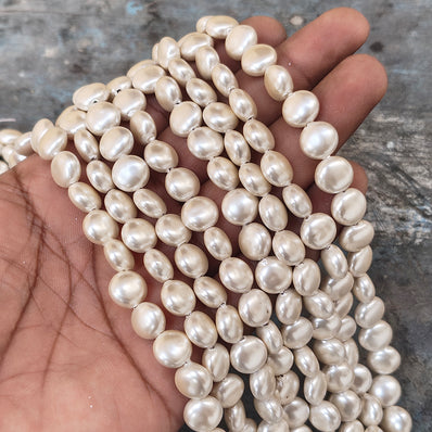 10mm, Coin Shape Shell Pearl Beads with a smooth, glossy finish, perfect for elegant necklaces, bracelets, and premium jewelry designs. Uniform, classy, and ideal for DIY creators. Sold Per Line 37~38 beads