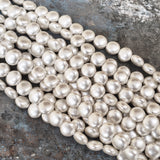 10mm, Coin Shape Shell Pearl Beads with a smooth, glossy finish, perfect for elegant necklaces, bracelets, and premium jewelry designs. Uniform, classy, and ideal for DIY creators. Sold Per Line 37~38 beads