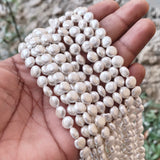 8mm, Coin Shape Shell Pearl Beads with a smooth, glossy finish, perfect for elegant necklaces, bracelets, and premium jewelry designs. Uniform, classy, and ideal for DIY creators. Sold Per Line 47~48 beads