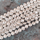 8mm, Coin Shape Shell Pearl Beads with a smooth, glossy finish, perfect for elegant necklaces, bracelets, and premium jewelry designs. Uniform, classy, and ideal for DIY creators. Sold Per Line 47~48 beads