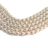 8x6mm Oval Shape Shell Pearl Beads with a smooth glossy finish, ideal for elegant necklaces, bracelets, and premium jewelry making. Uniform, stylish, and perfect for DIY creators. Sold Per Line 51~52 beads