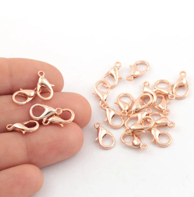 12 MM SIZE, LOBSTER CLASPS, Rose gold PLATED, MATERIAL ZINC, SOLD BY PER PKG OF 20 PIECES USED IN JEWELLERY MAKING.