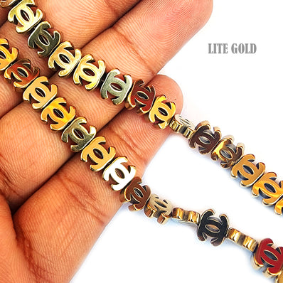 2 PIECES PACK' CHANEL LOGO' ELECTROPLATED' NON MAGNETIC LITE GOLD SHADE HEMATITE BEADS' 6x7 MM