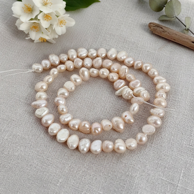 High-quality Freshwater Pearl Beads with natural shine and smooth texture. Perfect for necklaces, bracelets, and premium jewelry making. Ideal for designers and DIY creators. 5~6mm Approximately size Sold Per Line, About 65~70 Beads