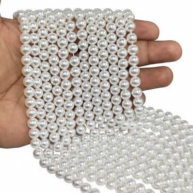 8mm Round Shell Pearl Beads with a smooth glossy finish, ideal for premium necklaces, bracelets, and elegant jewelry designs. Uniform, durable, and perfect for DIY projects. Sold Per Line 51~52 beads