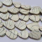 Synthetic Howlite beads size about  15x17mm 75 Beads