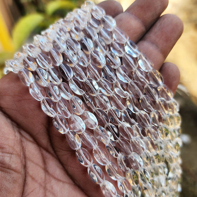 SUPER QUALITY' 9x6 MM FANCY SHAPE CLEAR WHITE FIRE POLISHED GLASS BEADS' APPROX 35-36 BEADS SOLD BY PER LINE PACK