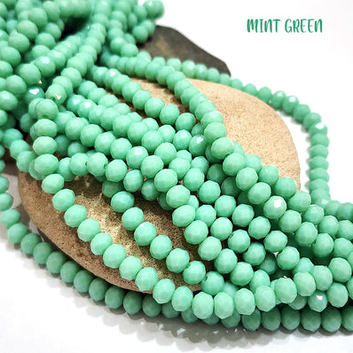 PER LINE 6MM FACETED OPAQUE RONDELLE SHAPED CRYSTAL BEADS, STRAND LENGTH -( APPROXIMATELY 80 BEADS)