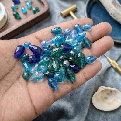 200 Pcs Pkg. Blue Color, Drop Faceted Crystal Glass beads, size encluded as 5X7MM, 8X12MM, 10X15MM AND SOME 3X5MM