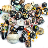 500 Gram Pack, Black tone, Bead mix, lampworked glass, opaque to transparent mixed colors, 7x4mm-20x11mm mixed shapes with 1.5-2mm hole. Sold per 500 Grams pkg, approximately 180~280 beads. Depend on the size