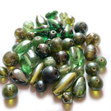 Bead mix, glass, Green colors, 4x3mm-42x12mm mixed shape. Sold per 250 Gram pkg, approximately 200~225 beads. Depend on the size