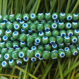 GREEN OPAQUE' 8 MM ROUND ' SUPER FINE QUALITY EVIL EYE GLASS CRYSTAL BEADS SOLD BY PER LIN PACK' APPROX PIECES 47-48 BEADS
