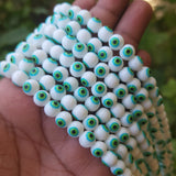 MILKY WHITE WITH GREEN EYE ' 8 MM ROUND ' SUPER FINE QUALITY EVIL EYE GLASS CRYSTAL BEADS SOLD BY PER LIN PACK' APPROX PIECES 47-48 BEADS
