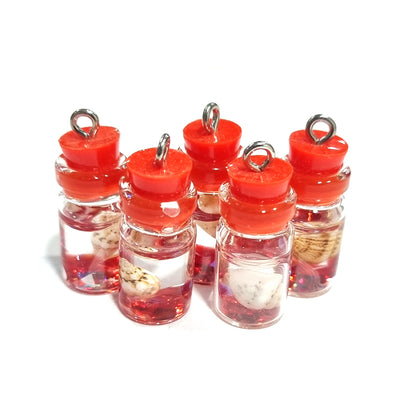 BEAUTIFUL TUBE PENDANTS FILLED WITH COWRIE SHELLS SOLD BY PER PIECE PACK' 20 MM APPROX