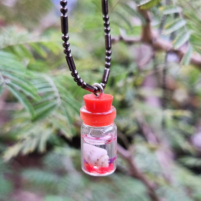 BEAUTIFUL TUBE PENDANTS FILLED WITH COWRIE SHELLS SOLD BY PER PIECE PACK' 20 MM APPROX