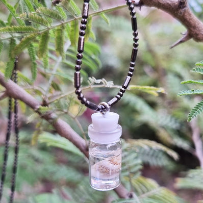 BEAUTIFUL TUBE PENDANTS FILLED WITH COWRIE SHELLS SOLD BY PER PIECE PACK' 20 MM APPROX