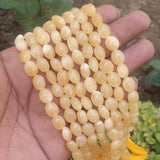 AA QUALITY' YELLOW CALCITE ' SEMI-PRECIOUS BEADS, SOLD BY STRAND ABOUT 11" ABOUT (29-30) BEADS' SIZE 9x7 MM APPROX